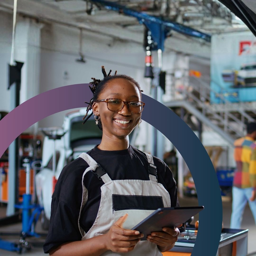 Small business owner reviewing work on laptop while consulting with a client